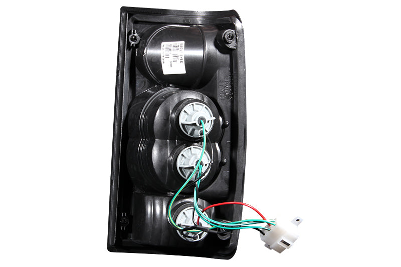 ANZO 1989-1995 Toyota Pickup Tail Light Assembly with Clear Lens and Black Housing – Pair