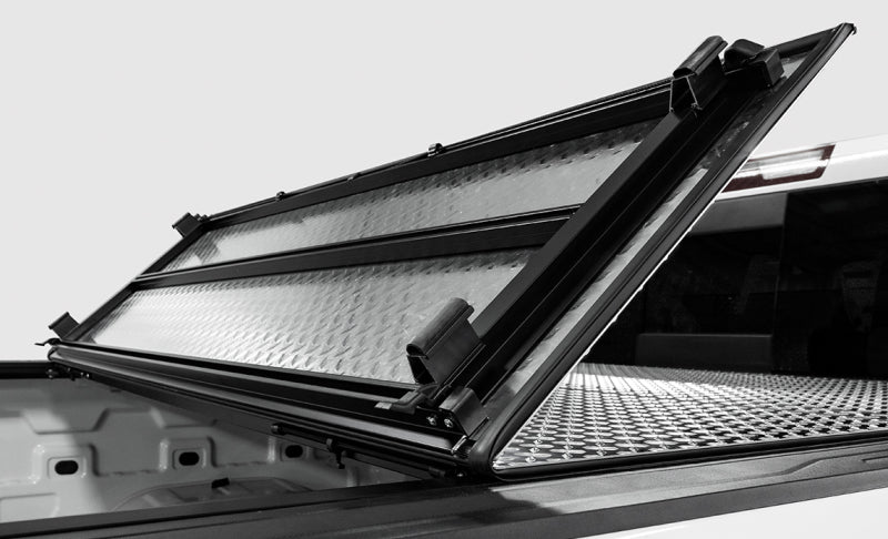 Access LOMAX Tri-Fold Hard Tonneau Cover for 2022-2023 Toyota Tundra 5' 6" Bed with Deck Rail - Matte Black