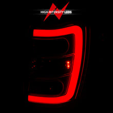 Load image into Gallery viewer, ANZO 1999-2004 Jeep Grand Cherokee LED Tail Light Assembly with Light Bar, Chrome Housing, Red and Clear Lenses