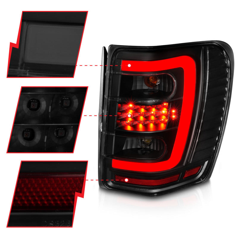 ANZO 1999-2004 Jeep Grand Cherokee LED Tail Light Set with Light Bar and Smoke Lens - Black Housing