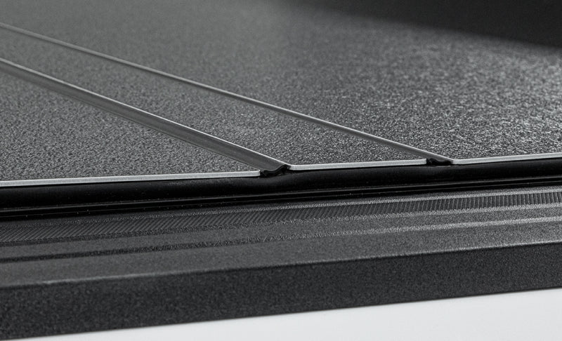 Access LOMAX Tri-Fold Hard Tonneau Cover for 2022-2023 Toyota Tundra 5' 6" Bed with Deck Rail - Matte Black