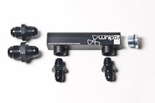 Load image into Gallery viewer, Radium Engineering Universal 4-Port Manifold - Black with Logo