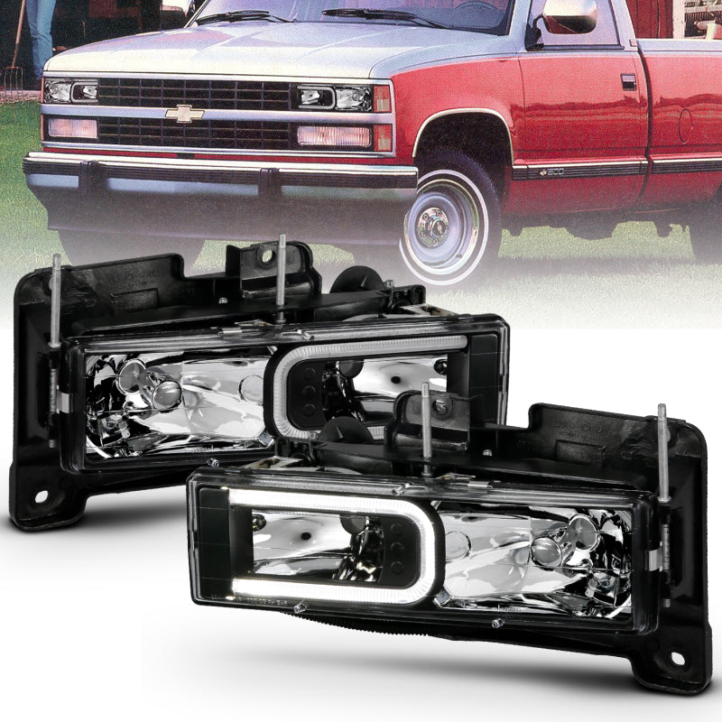 ANZO 1999-2000 Cadillac Escalade Crystal Headlights with LED Light Bar - Black Housing, Clear Lens (Pair)