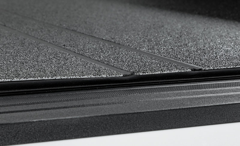 Access LOMAX Tri-Fold Hard Tonneau Cover for 2022-2023 Toyota Tundra 5ft 6in Bed with Deck Rail - Black Urethane Finish