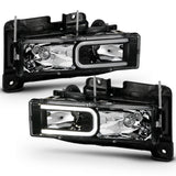 ANZO 1999-2000 Cadillac Escalade Crystal Headlights with LED Light Bar - Black Housing, Clear Lens (Pair)