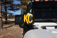 Load image into Gallery viewer, KC HiLiTES 6-inch Round Soft Vinyl Light Covers with Yellow KC Logo - Black
