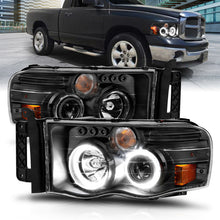 Load image into Gallery viewer, ANZO 2002-2005 Dodge Ram 1500 Projector Headlights with Halo - Black Housing, Clear and Amber Lenses (Pair)