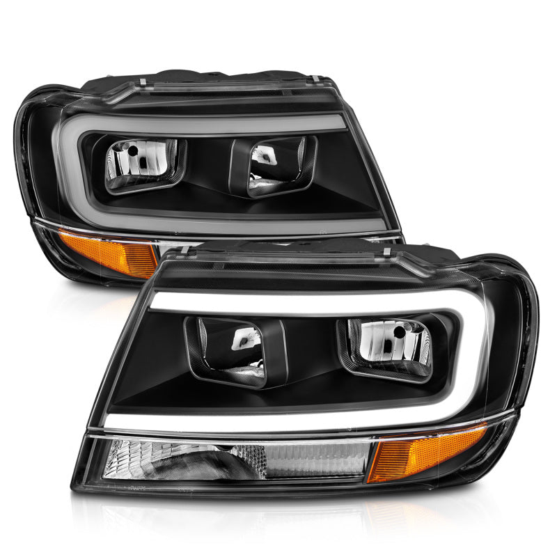 ANZO 99-04 Jeep Grand Cherokee Crystal Headlights with Light Bar, Black Housing, Clear Lens – Pair