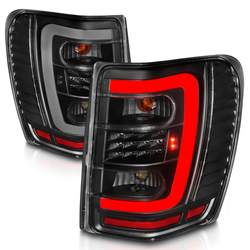 ANZO 1999-2004 Jeep Grand Cherokee LED Tail Light Set with Light Bar, Black Housing & Clear Lens