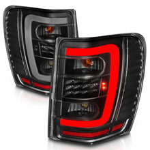 Load image into Gallery viewer, ANZO 1999-2004 Jeep Grand Cherokee LED Tail Light Set with Light Bar, Black Housing &amp; Clear Lens