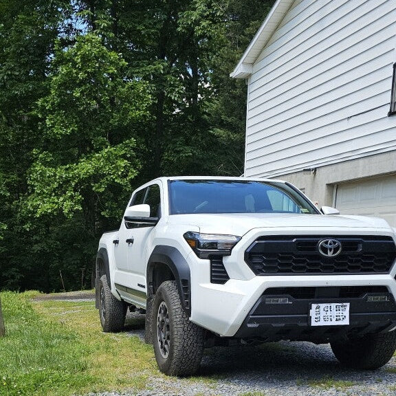 Rally Armor UR Series Mud Flaps for Toyota Tacoma 2024, Black with White Logo – Durable Polyurethane Design